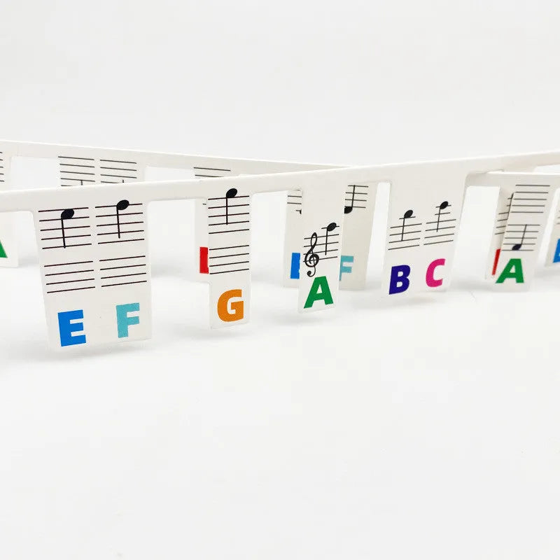 White cardboard piano stickers for 88-key keyboards in black notes or colour bar options