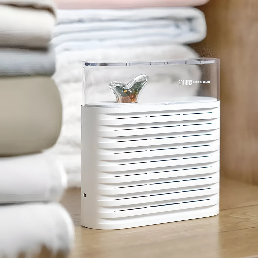 White recyclable dehumidifier box for cabinets with transparent lid showing colour-changing crystals and compact size.