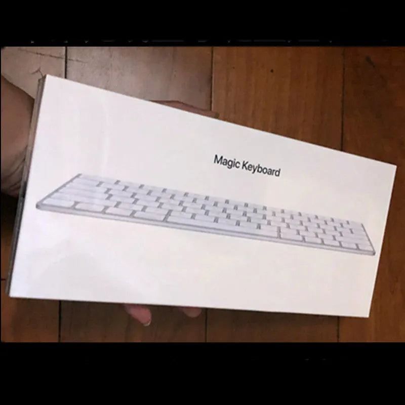 White Apple Bluetooth wireless keyboard with ultra-thin metal construction and multimedia function keys