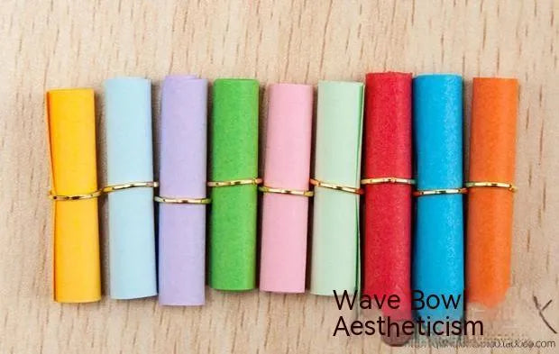 Colourful drift bottle message paper scrolls in various sizes with metal eyelets for hanging.