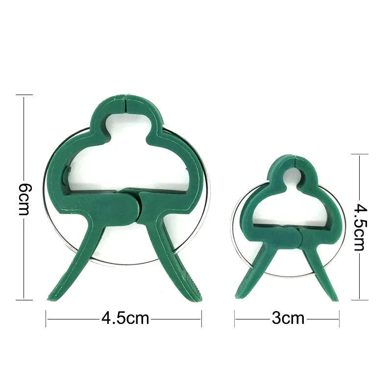 Green plastic and zinc plant fixing clips for supporting climbing tomatoes and beans