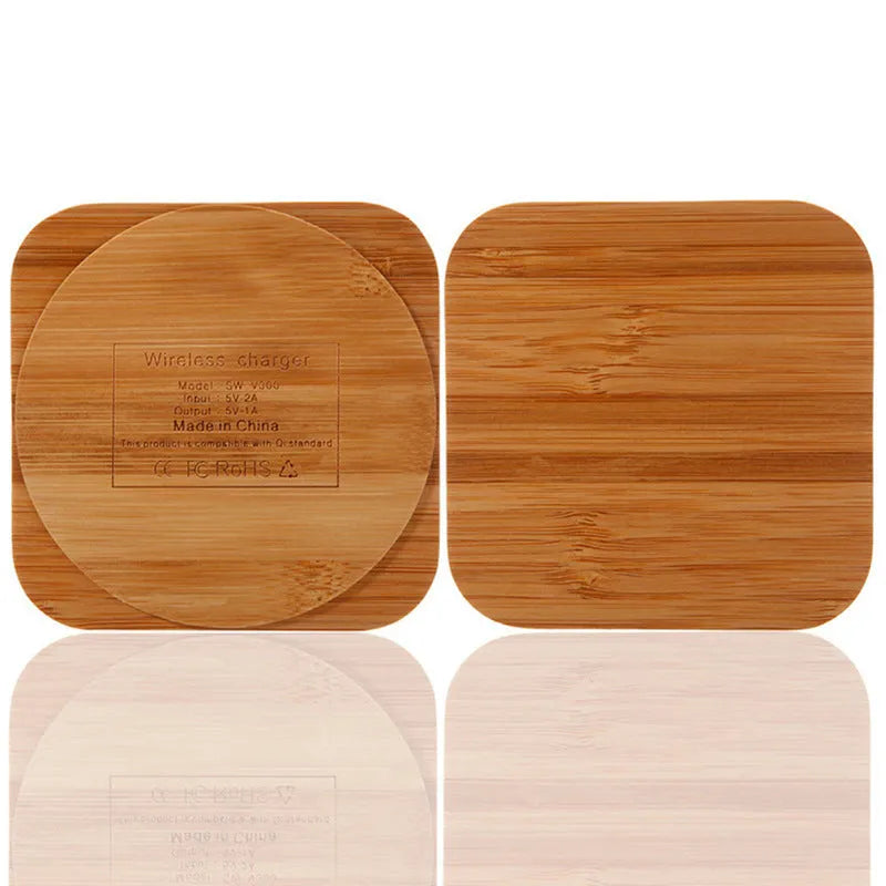 Square brown wooden bamboo 5W Qi wireless charging pad on a table.