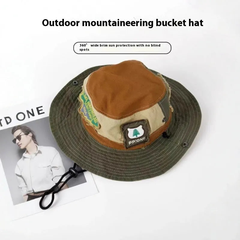 Women's army green cotton fisherman hat with hand-painted patchwork design and flat top crown