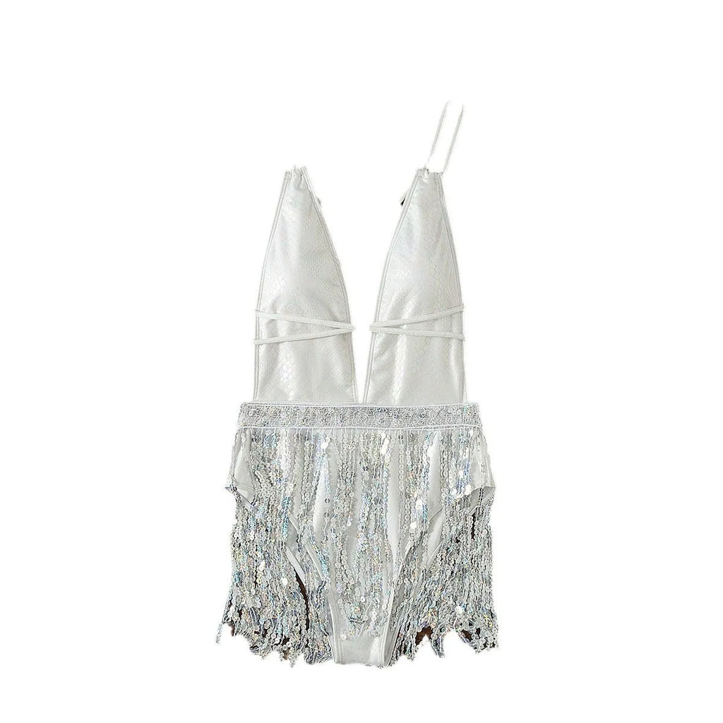 White women's one-piece swimsuit with deep V-neck and tassel detail on a brief cut.