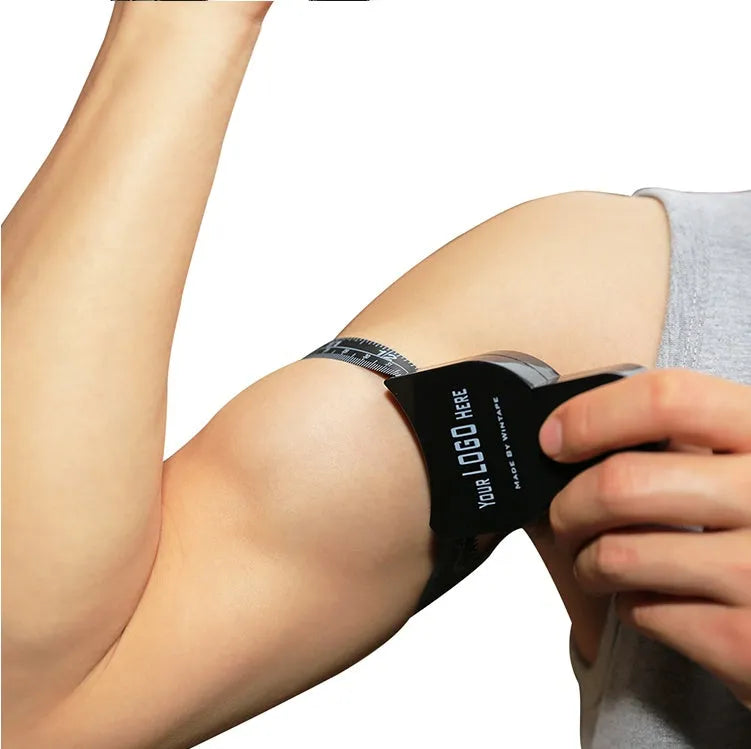 Black ABS body fat measuring calliper with measurement scale and cable