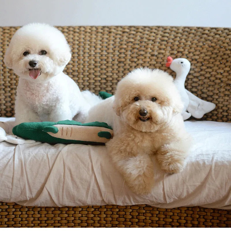 Green plush toy dog measuring 35cm long on a white background
