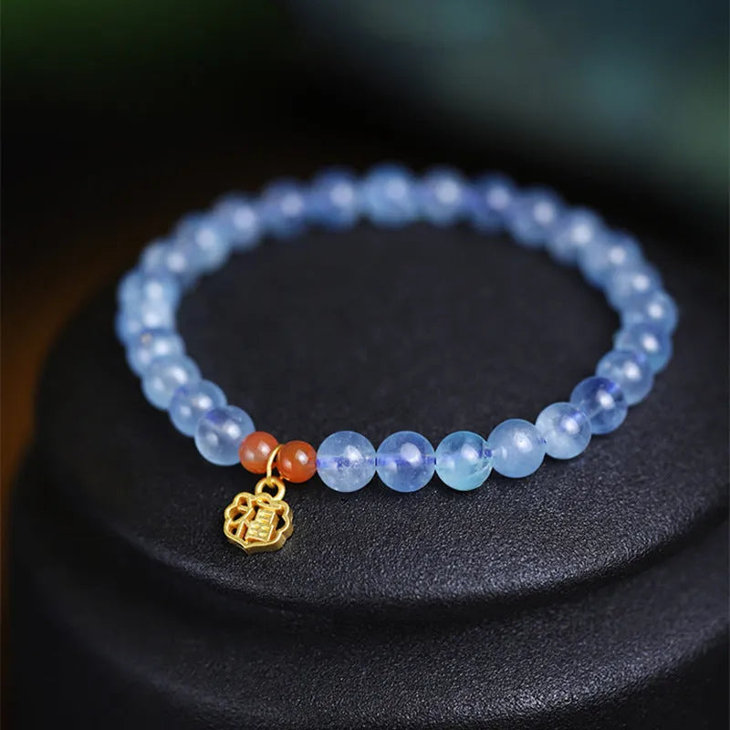 Ice translucent aquamarine crystal bracelet with 8mm round beads and sequin elements