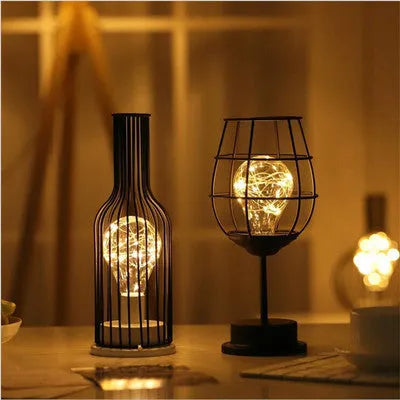 Minimalist iron hollow table lamp with wine bottle design and warm white LED lighting