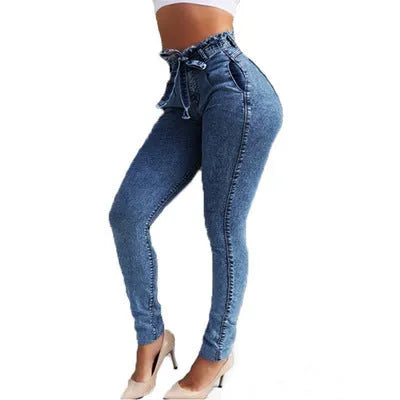 Women's fringed jeans with distressed hem in grey, dark blue, and light blue colours, showing five-pocket design and loose fit
