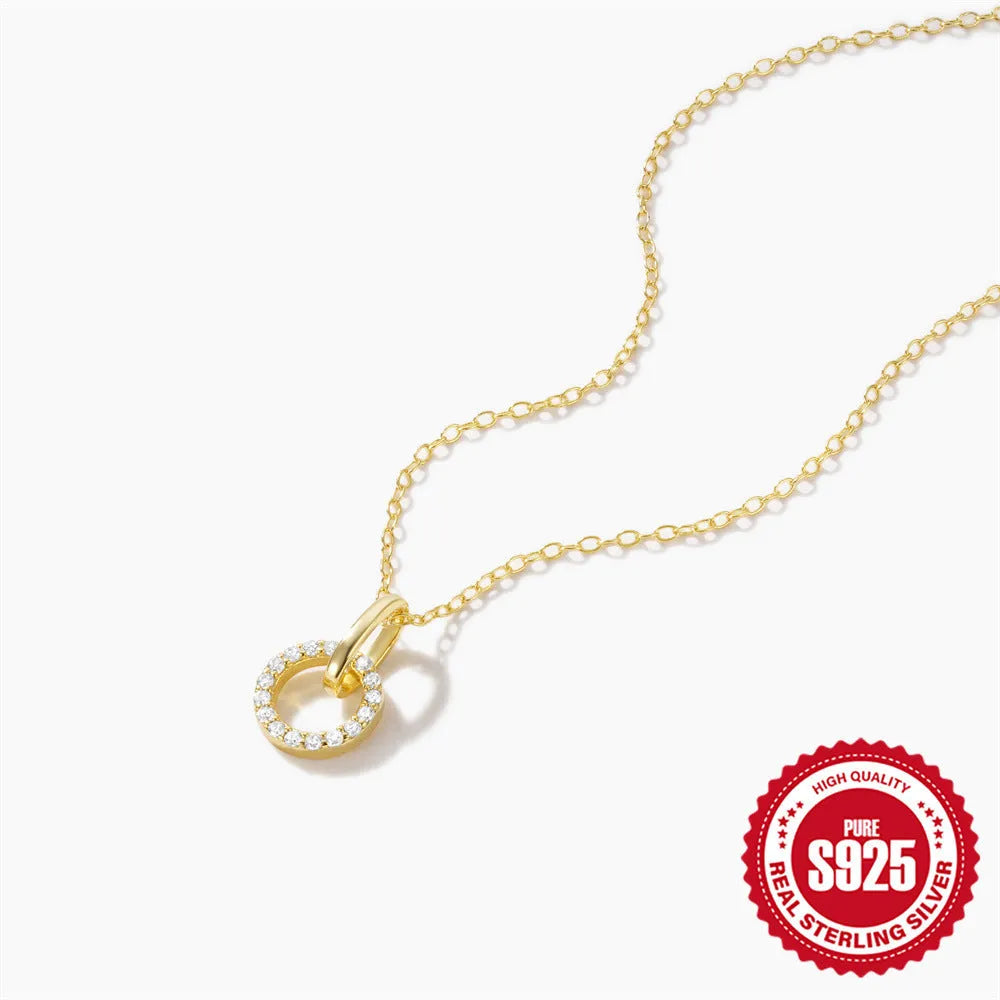 Gold-coloured S925 sterling silver clavicle chain with an interlocking geometric zircon pendant.