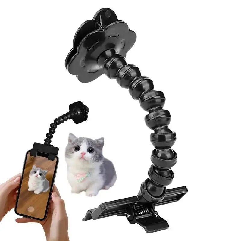 Black pet photography tool with rotating mount and phone clip for holding treats during animal photoshoots