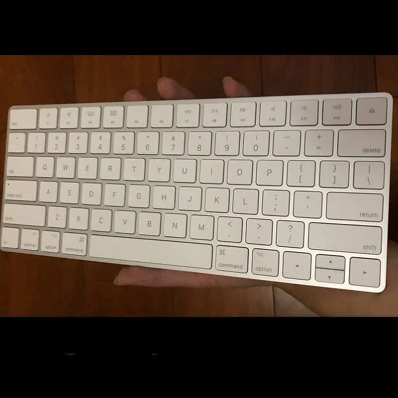White Apple Bluetooth wireless keyboard with ultra-thin metal construction and multimedia function keys