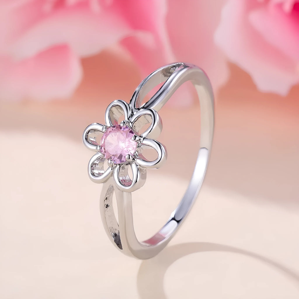 Close-up of a ladies floral hollow ring in electroplated copper with a platinum pink diamond finish.