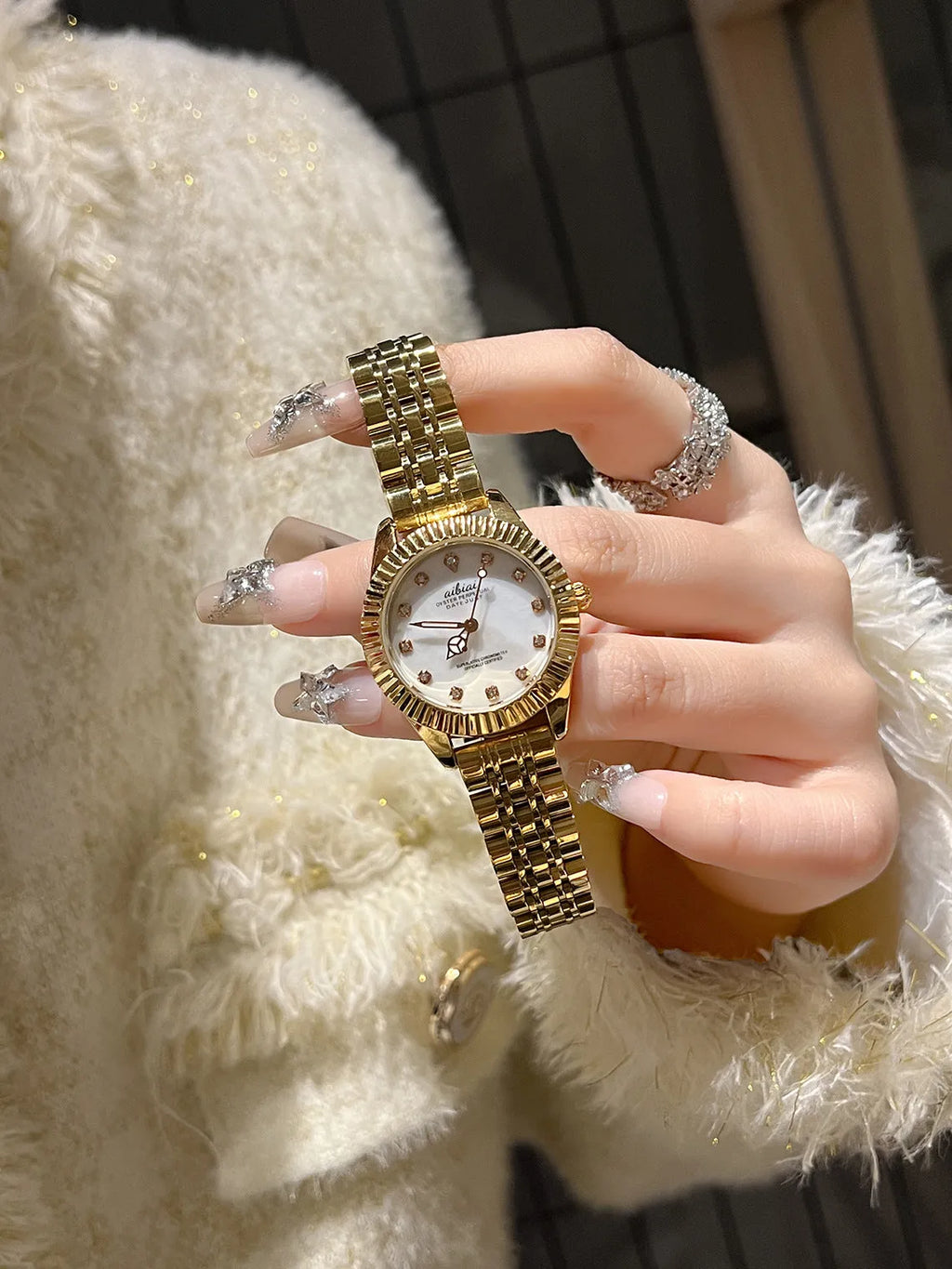 Women's rose shell dial watch with 7mm slim case, shown with leather or steel strap options