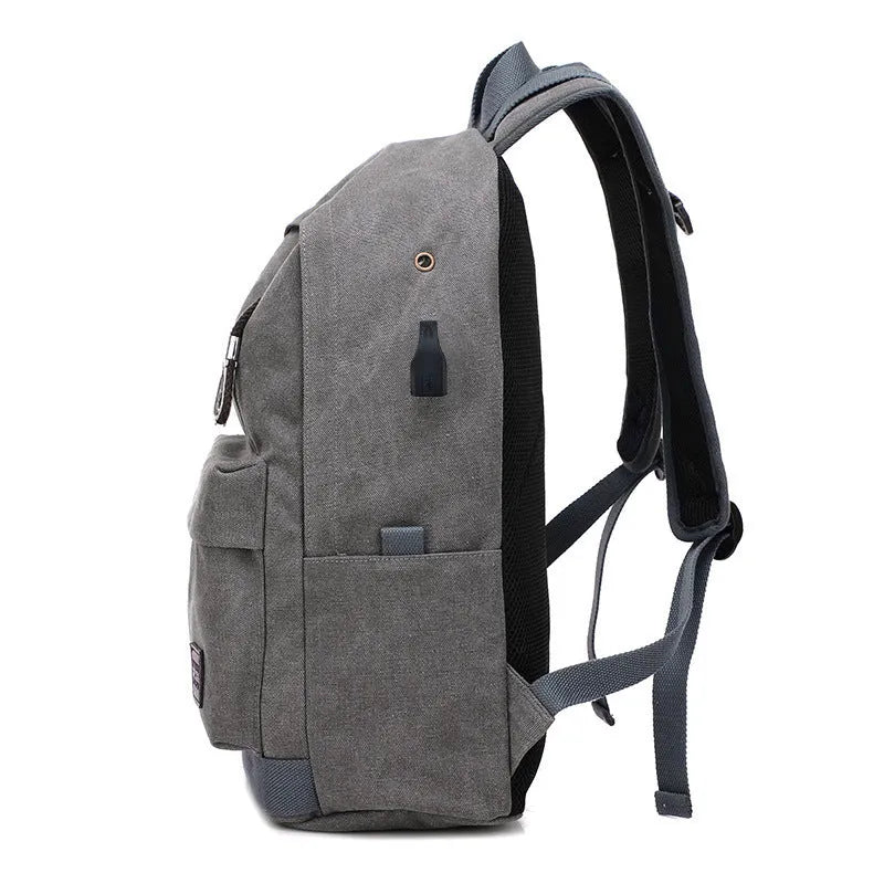 Canvas USB charging backpack in khaki colour showing front compartment and USB port.