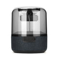 Black wireless Bluetooth speaker with multi-colour LED halo lights glowing around its base.