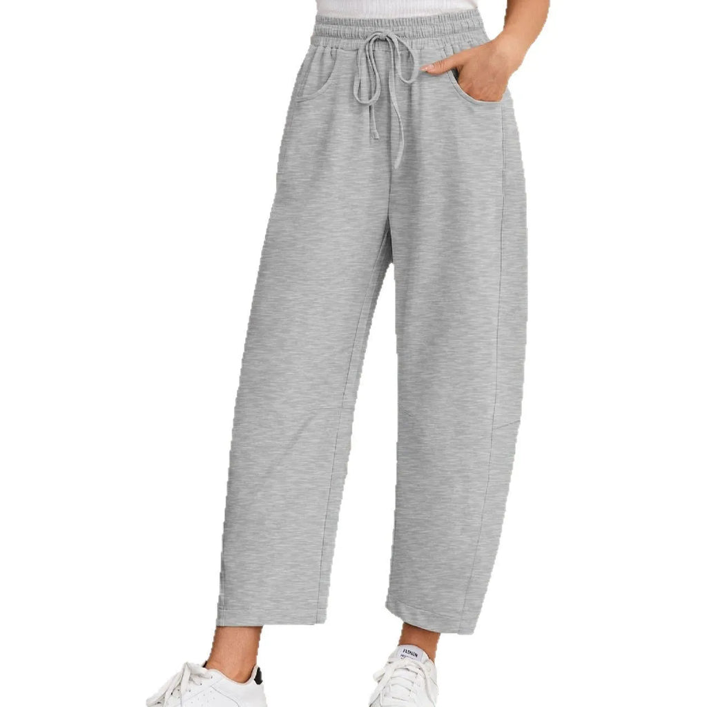 Loose cropped sweatpants with drawstring elastic waist in street fashion styling