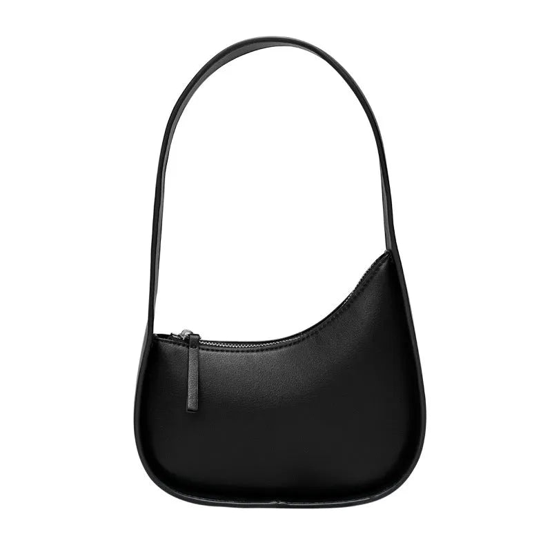 Small half moon leather ladies shoulder bag with wide strap in caramel colour