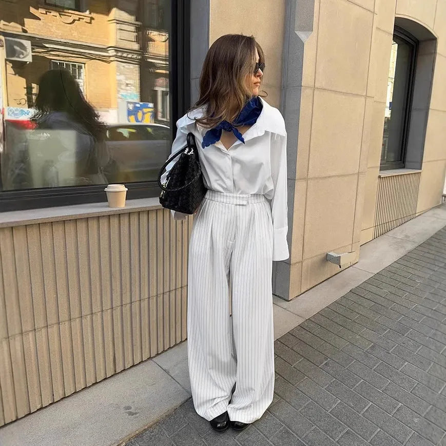 White striped wide-leg commuting trousers with zipper detailing on hanger