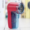 Portable electric clothing lint remover device with compact design