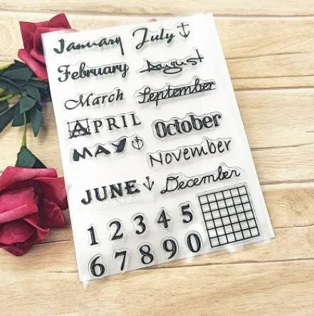 Close-up of a transparent silicone vintage calendar and digital table icon stamp on a white background.
