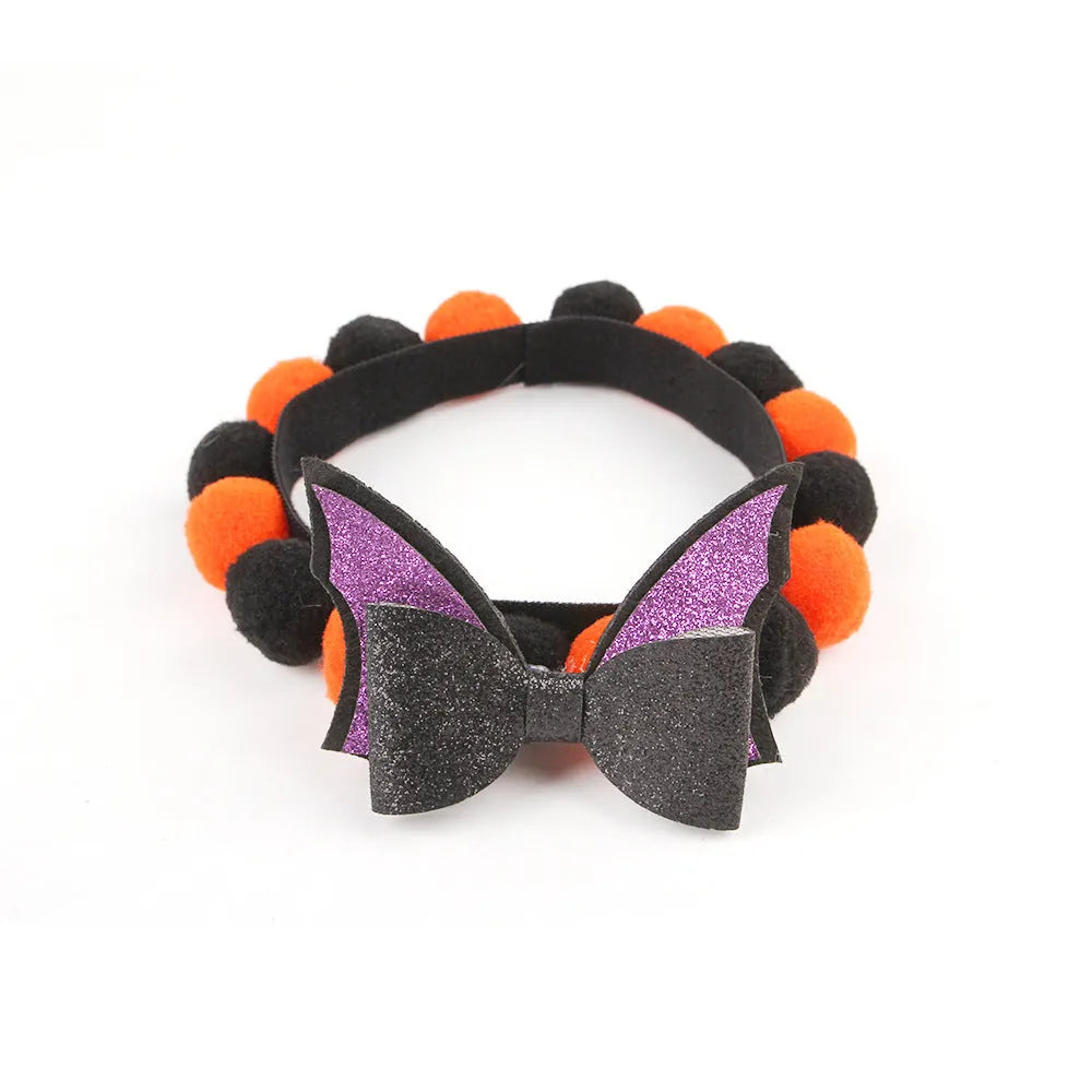 Halloween pet collar with decorative fur ball in pumpkin, bow, skull, and witch designs