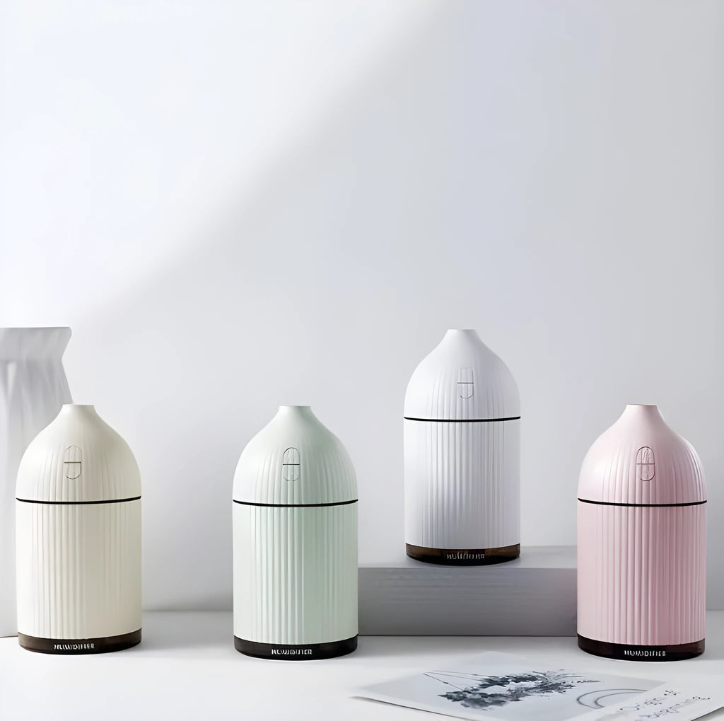 White USB-powered 300ml aromatherapy diffuser with LED light showing compact dimensions