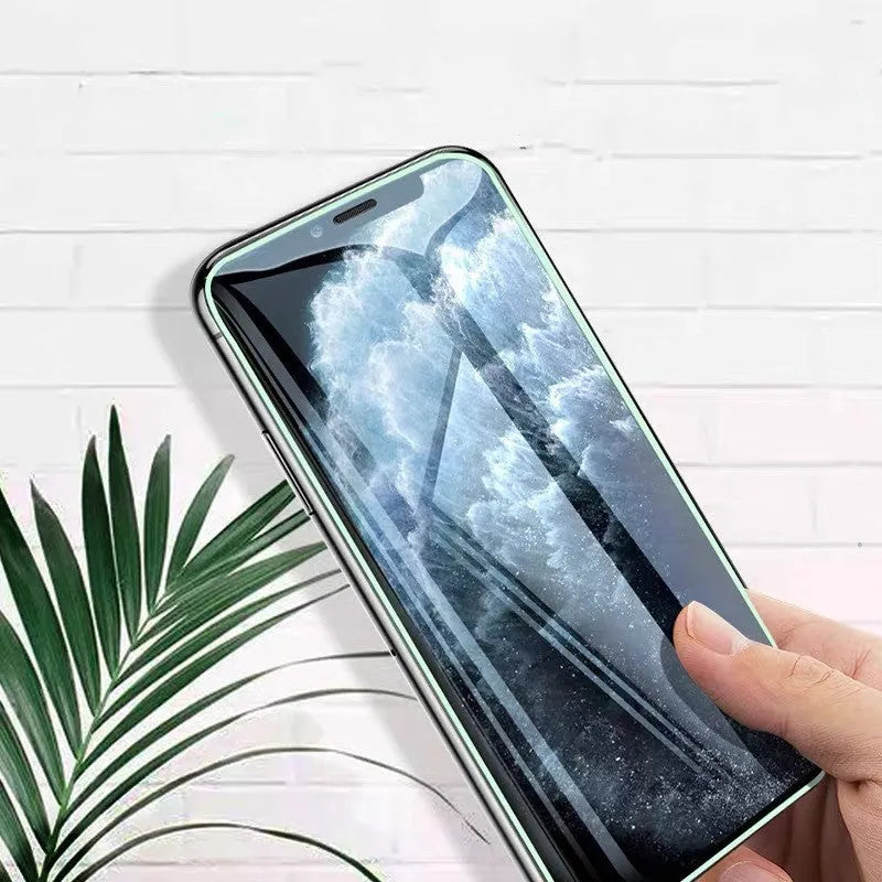 Luminous full cover tempered glass screen protector for iPhone showing glow effect in dark setting