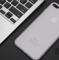 Flexible black TPU snap-on case for iPhone 7 shown next to blue, red, and white versions.