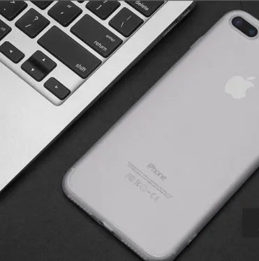 Flexible black TPU snap-on case for iPhone 7 shown next to blue, red, and white versions.