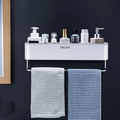 Black plastic wall-mounted bathroom shelf with adhesive installation holding shampoo and cosmetics
