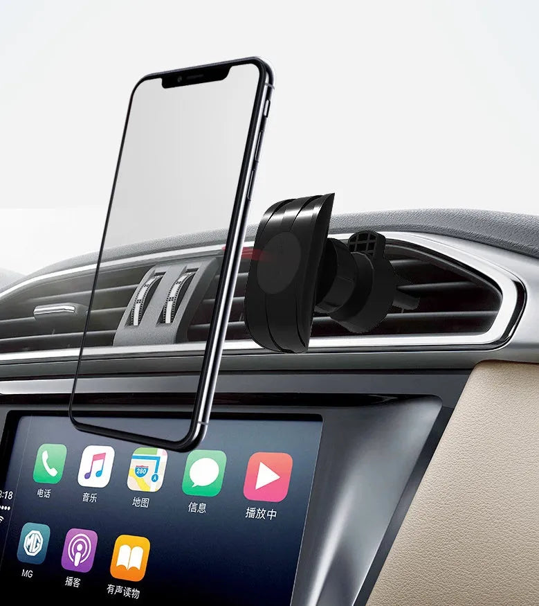 Black car phone holder mounted on car air vent with phone in adjustable clamp