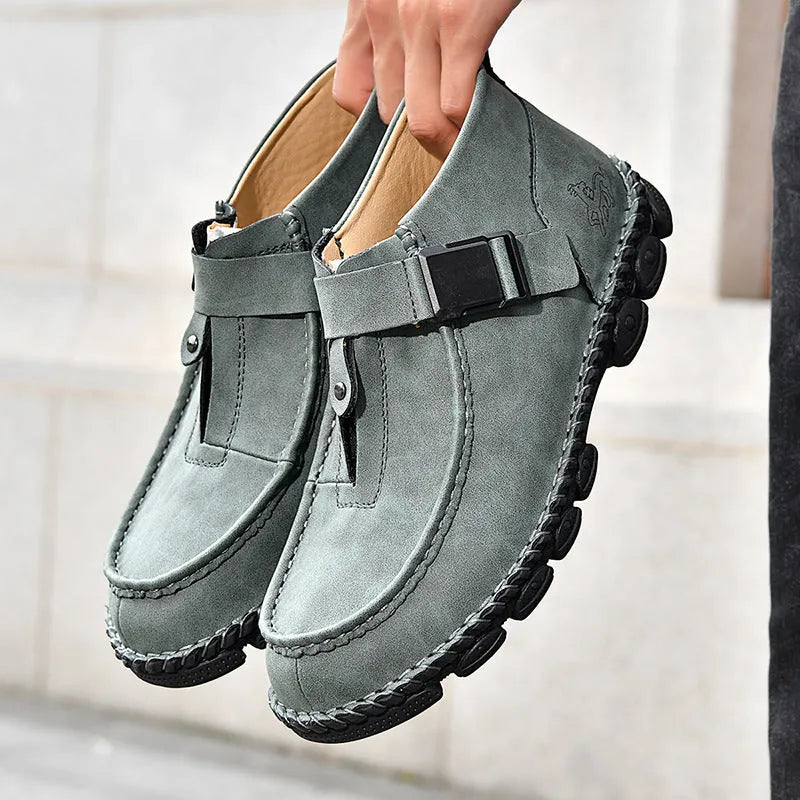 Men's black PU leather slip-on shoes with a flat sole and hand-stitched construction.