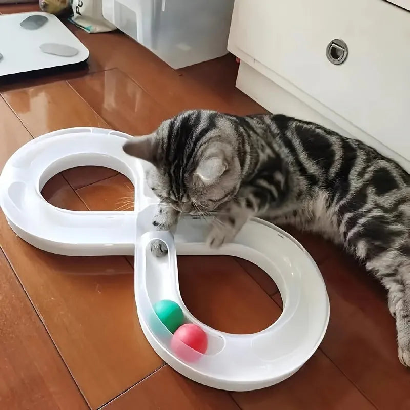 Blue and white cat turntable toy set with track balls and a feather teaser stick on a plain background.