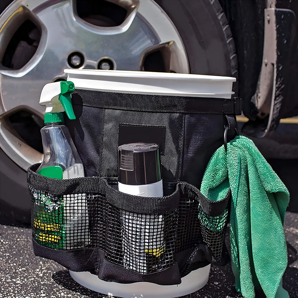 Black cylindrical polyester storage bag mounted on 5 gallon barrel for car washing and fishing gear organisation