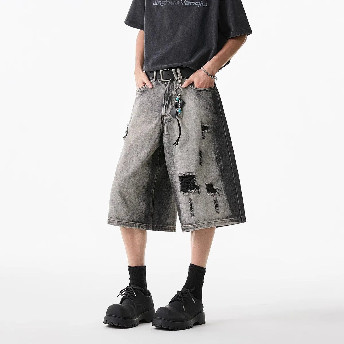 Grey washed denim shorts with distressed holes, loose-fit cropped design for summer casual wear