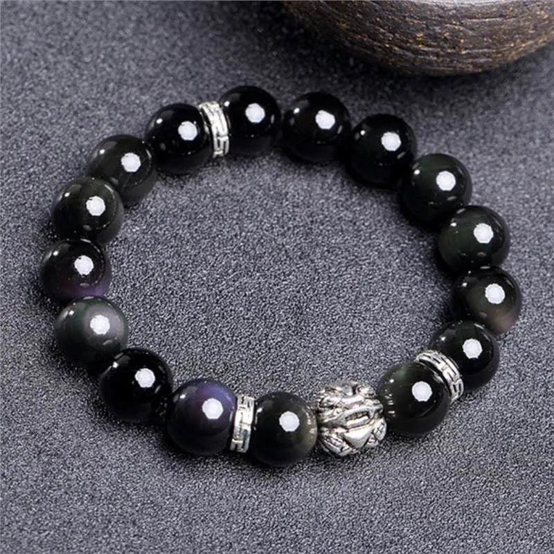 Silver 999 obsidian bracelet with lucky colour eye pattern showing male 12mm and female 10mm sizing options
