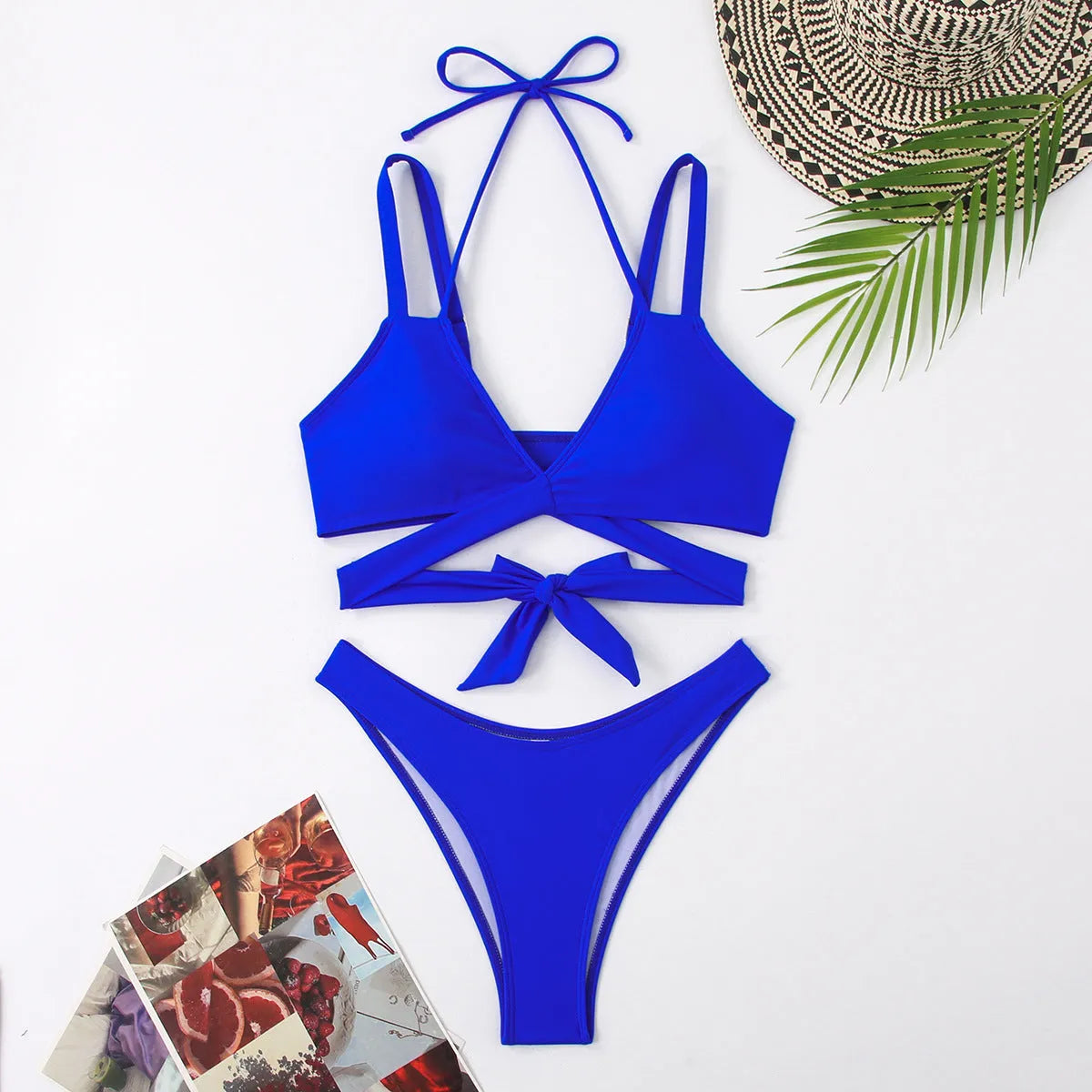 Women's solid colour strap bikini swimsuit on a hanger, showing the briefs style in one of the five available colours.