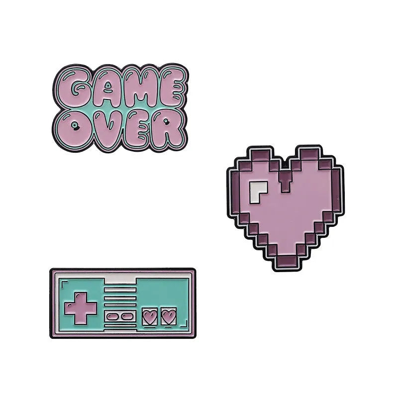 Stereo game console design metal badge with pin back, shown in one of three alloy colour options.