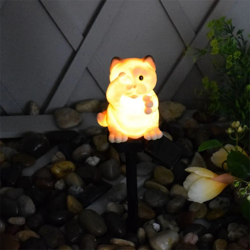 Solar cat lawn light with resin construction for garden pathways