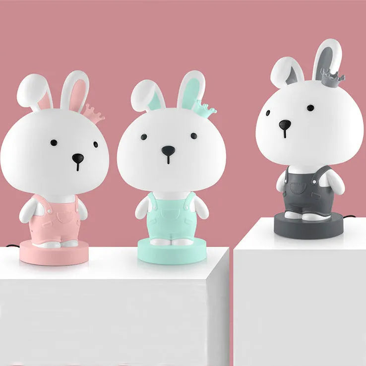 Animal table lamp with cartoon design showing bear, cattle, rabbit or tiger variations with LED light source