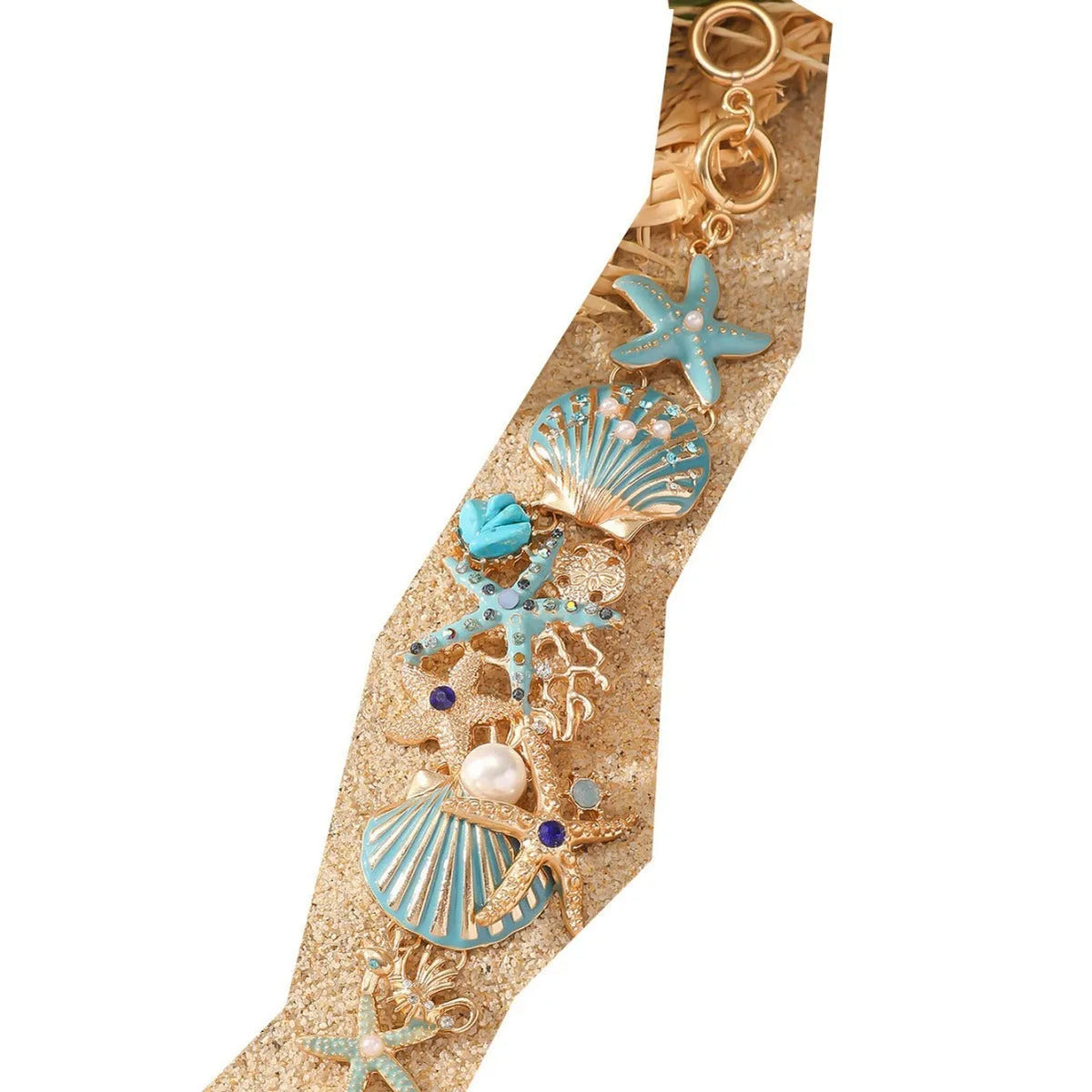 Women's alloy marine bracelet with boat anchor and starfish charms in turquoise, red, or blue coral colours.