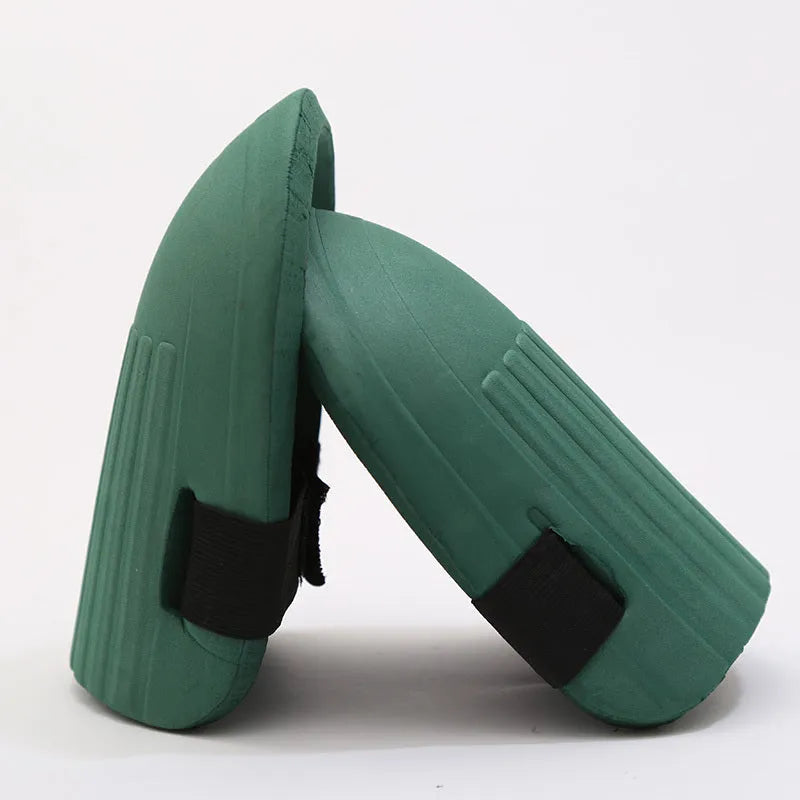 A pair of thick EVA foam knee pads in army green colour, shown on a grey background.