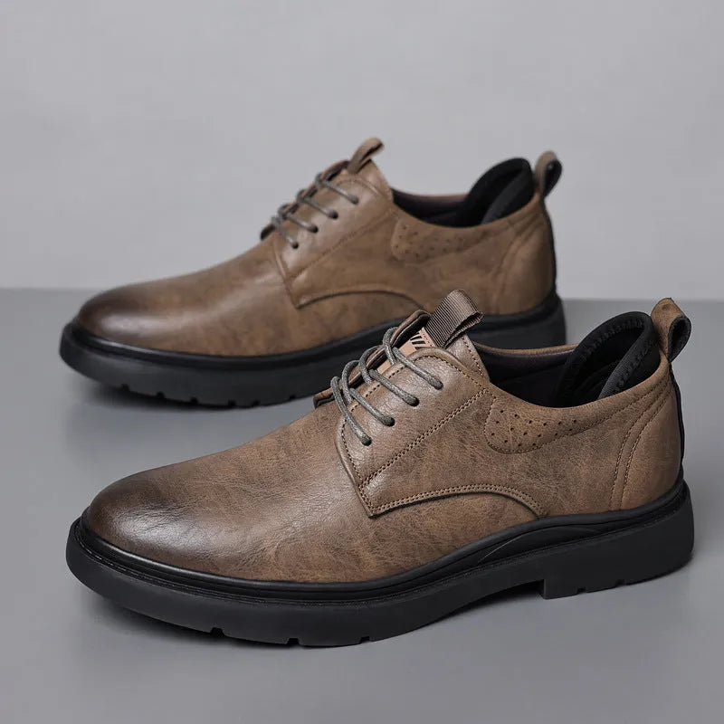 Men's black and brown breathable leather casual shoes with rubber sole and sewing line detail.