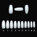 500 clear and natural coloured ABS plastic false nails in ten different sizes arranged on a white surface