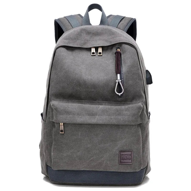 Canvas USB charging backpack in khaki colour showing front compartment and USB port.