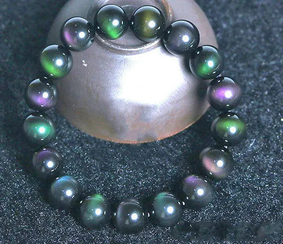 Rainbow eye obsidian bracelet with green, purple and gold colour eye beads in 8mm to 20mm sizes