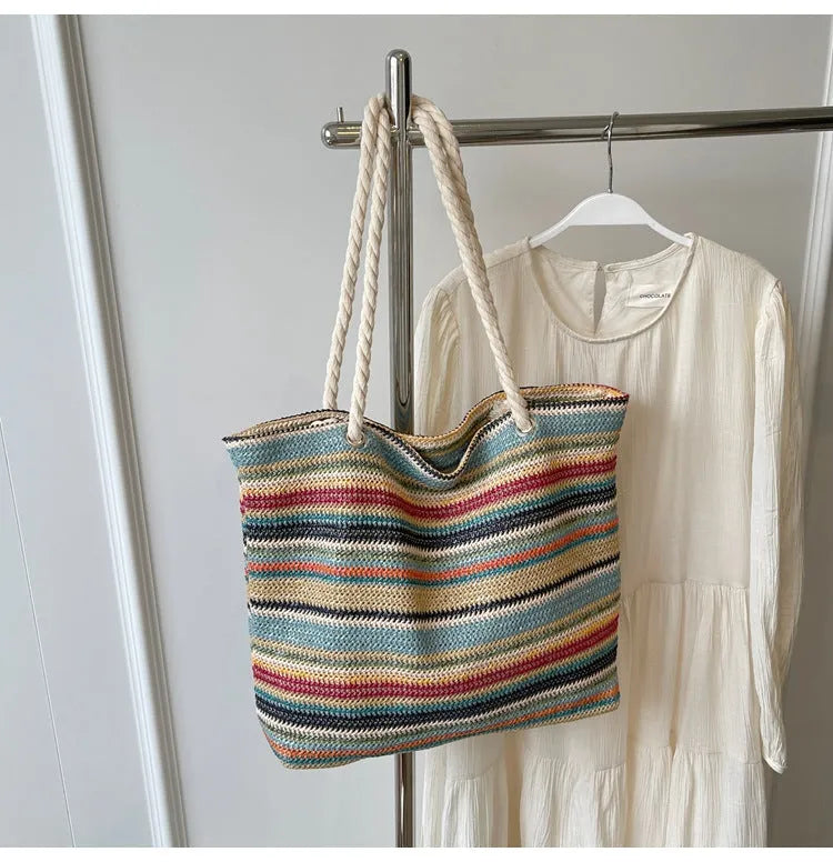 Blue woven shoulder bag with straw-effect pattern, large capacity design with single shoulder strap