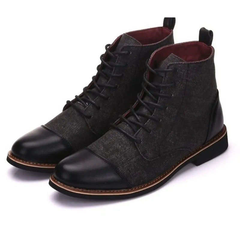A pair of large leather boots for men with belt buckle detail and a rubber sole.
