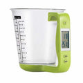 Green digital kitchen measuring cup with integrated LCD display showing weight and temperature measurements